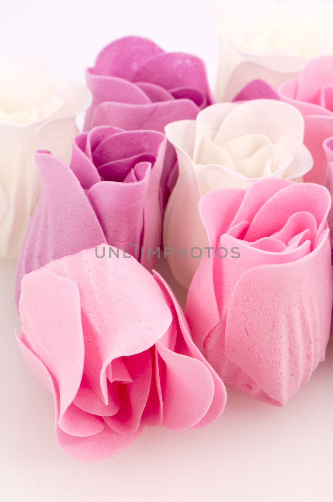 Pink, purple and white beautiful luxury soap roses background.