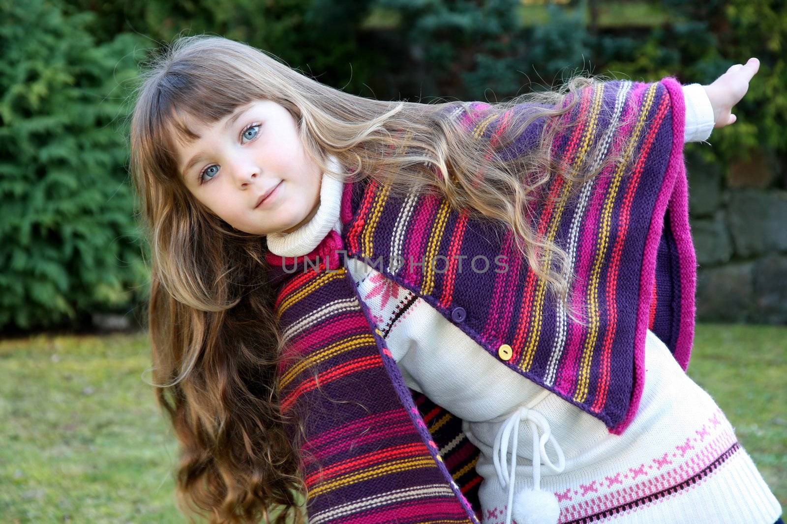 Beautiful little portrait of girl in park