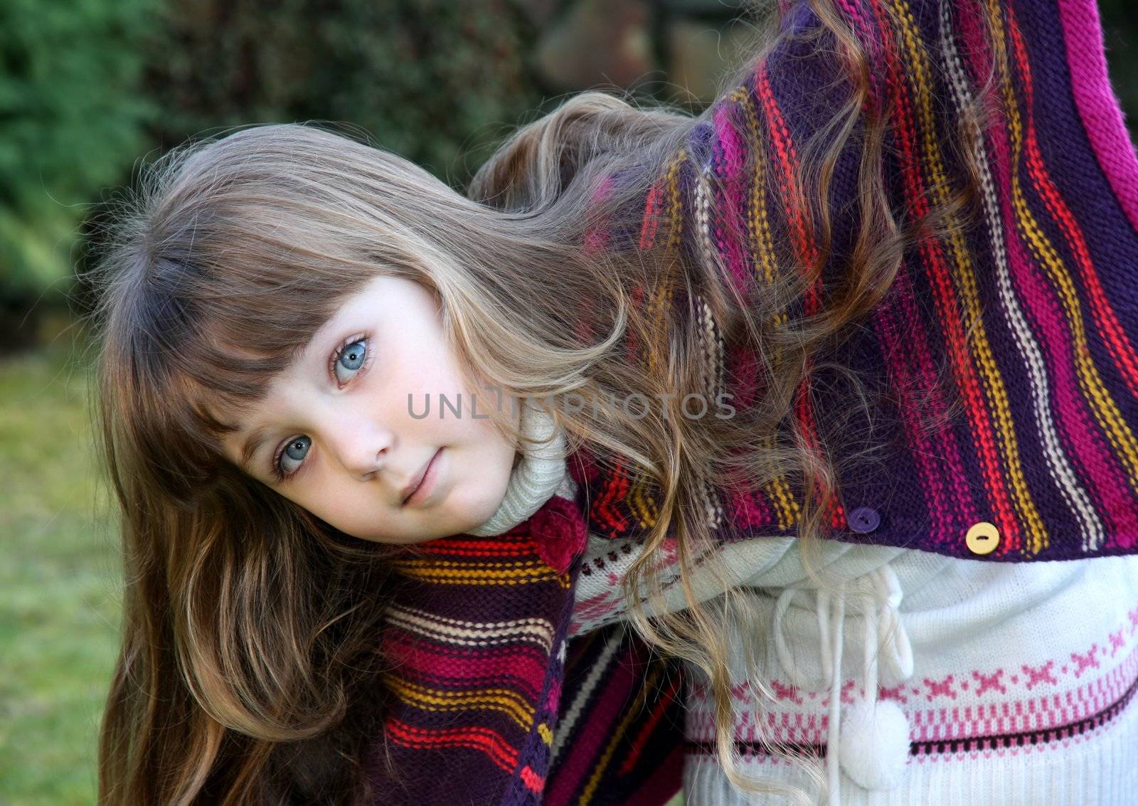 Beautiful little portrait of girl in park