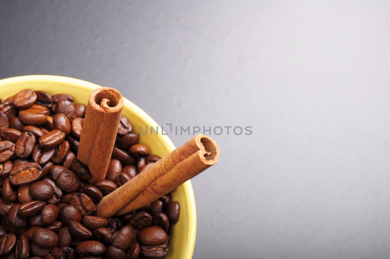 coffee beans and cinnamon with copyspace showing food concept