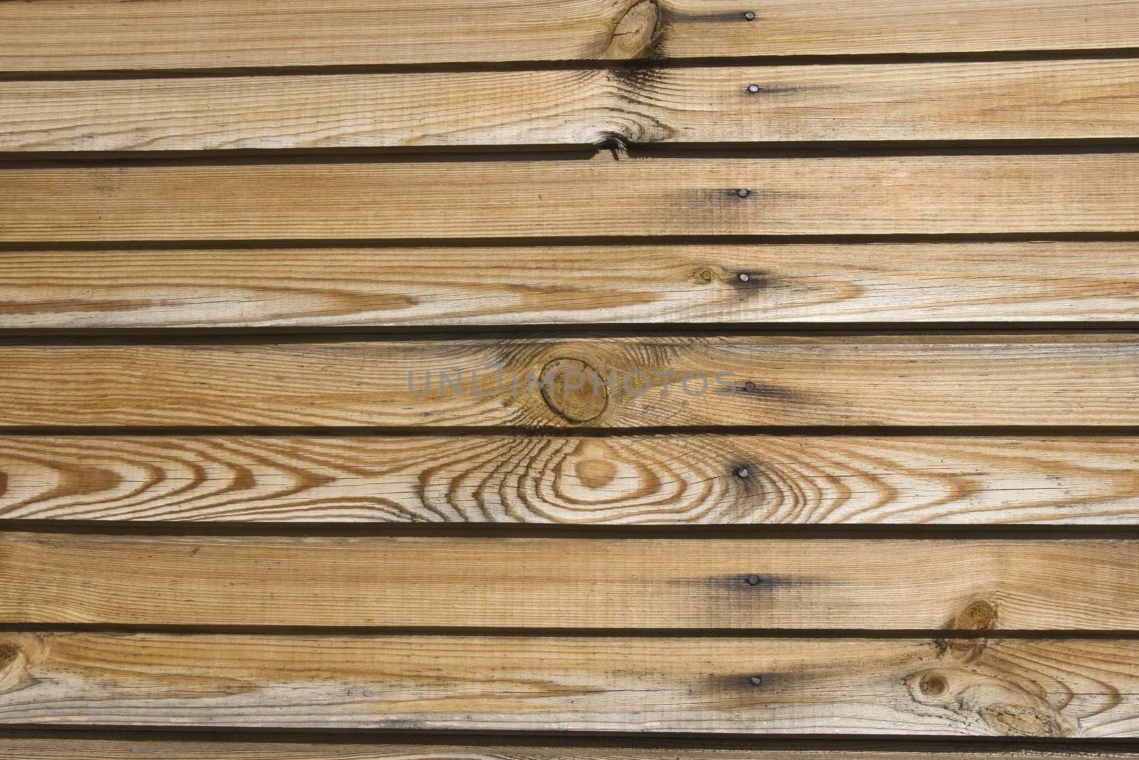 A background of weathered dark painted wood