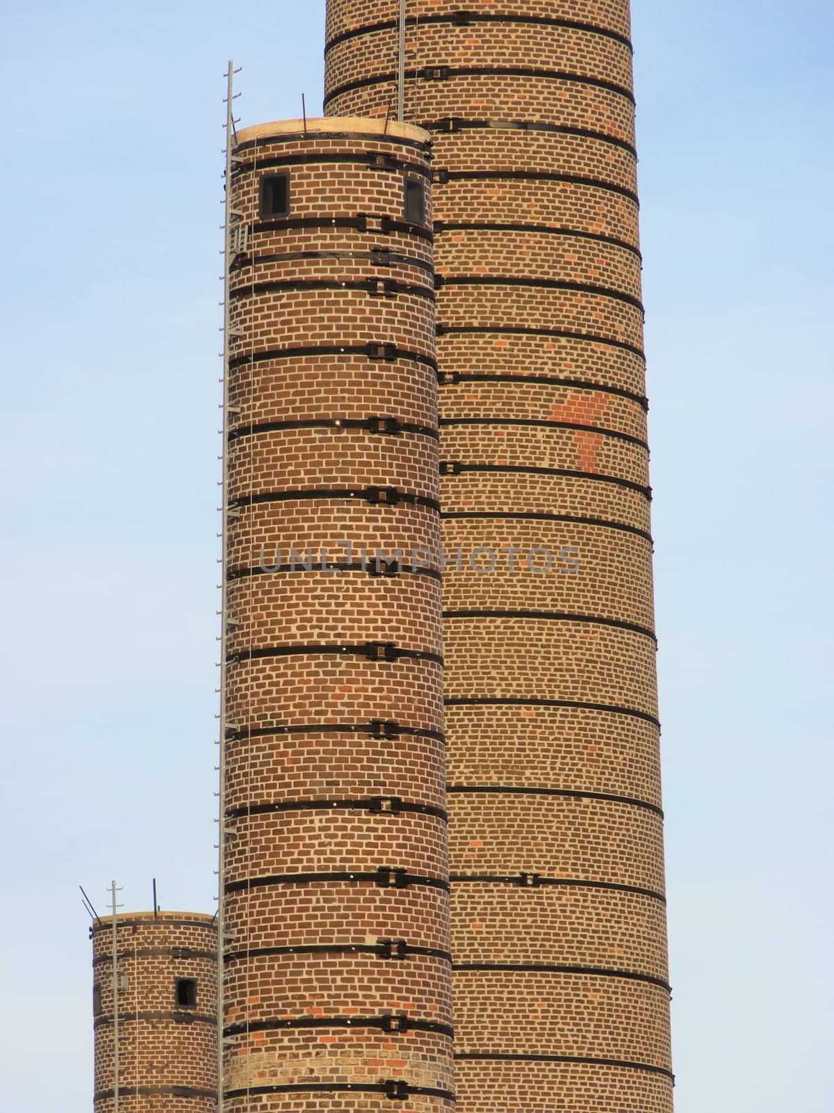 brick chimney in a factory by njaj