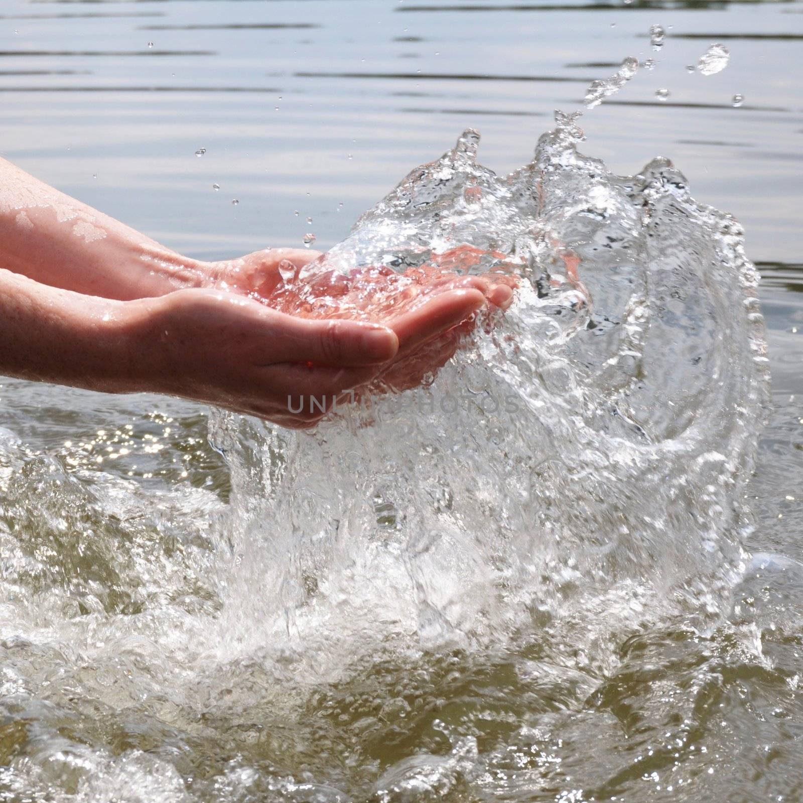 hand and splashing cold drink water showing nature concept