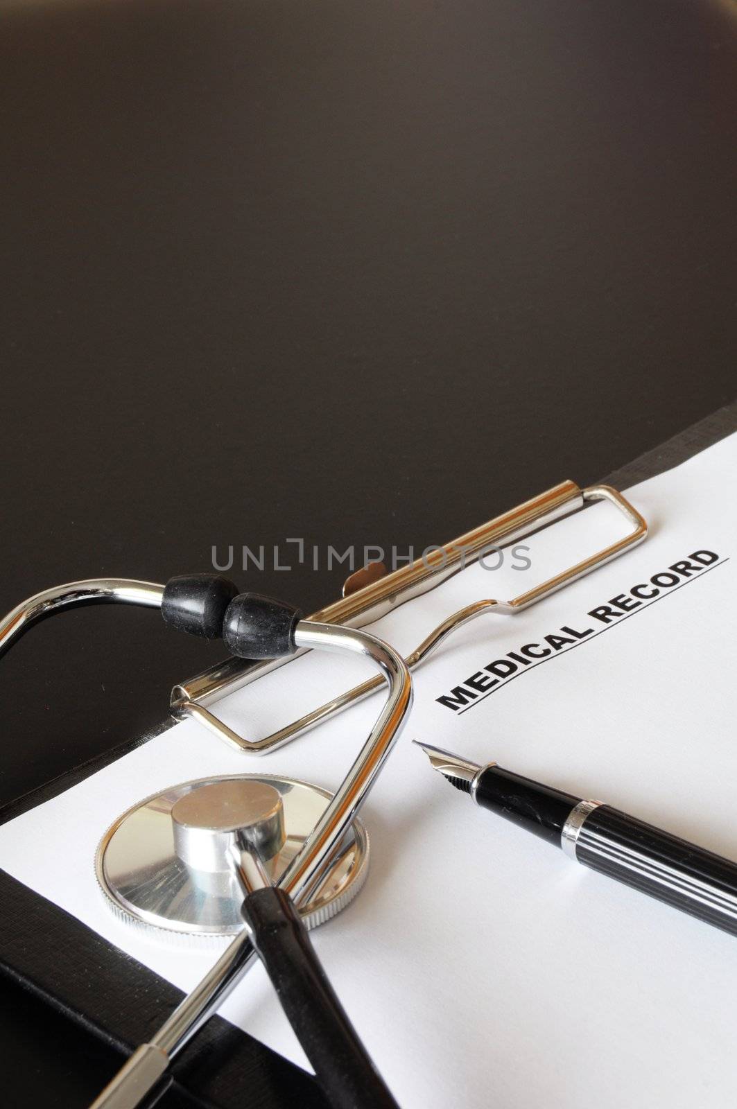 medical record clipboard and stethoscope showing health or medicine concept