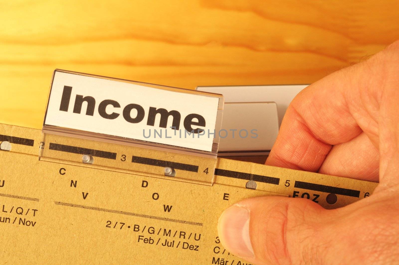 income word on business folder showing finance financial or earnings concept