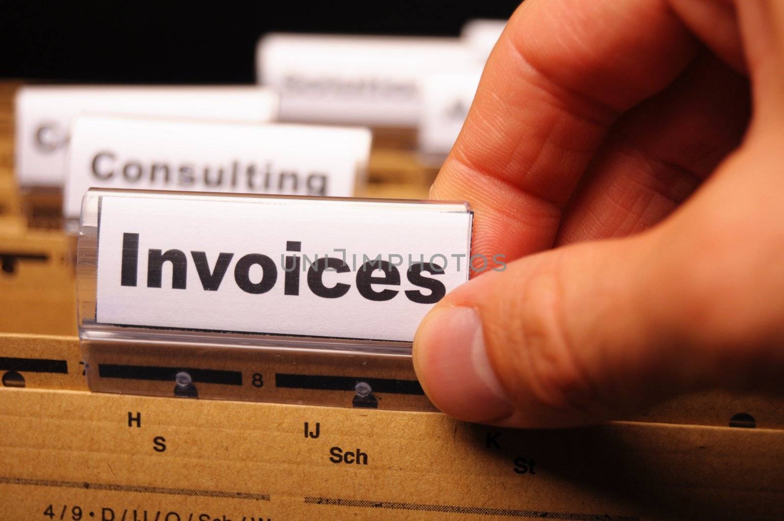 invoice or invoices concept with business folder in office showing paperwork