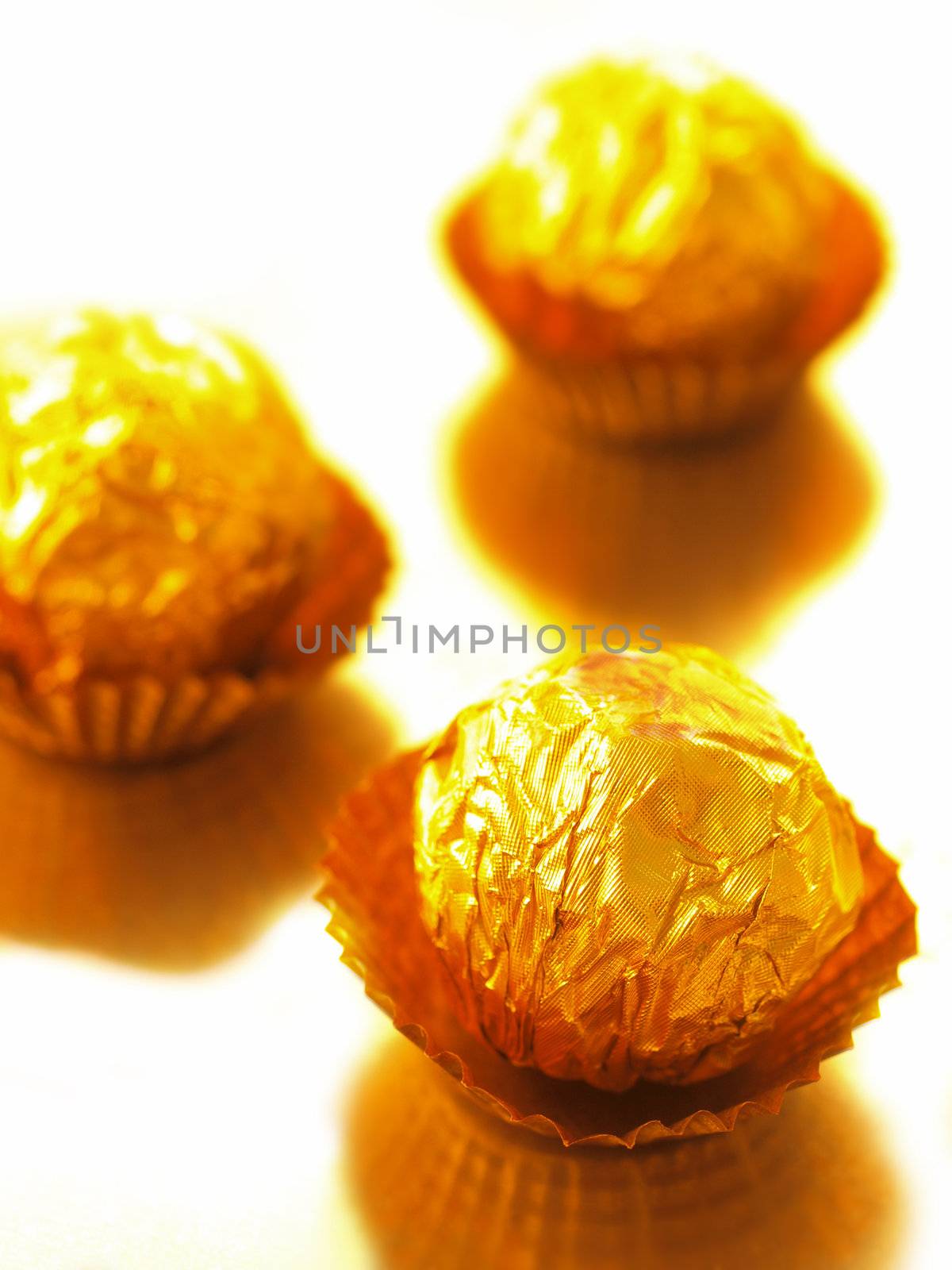 close up of candy with gold wrappers
