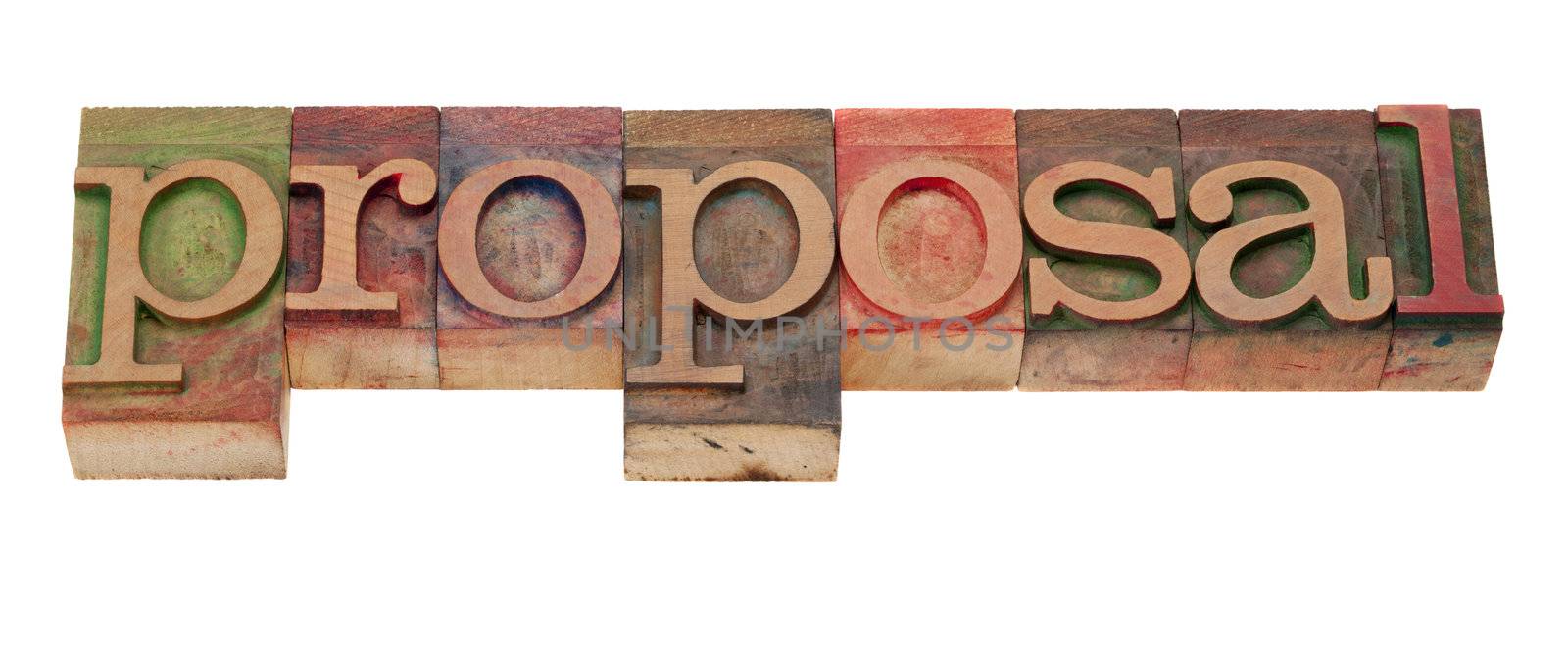 proposal word in vintage wooden letterpress printing blocks, stained by color inks, isolated on white