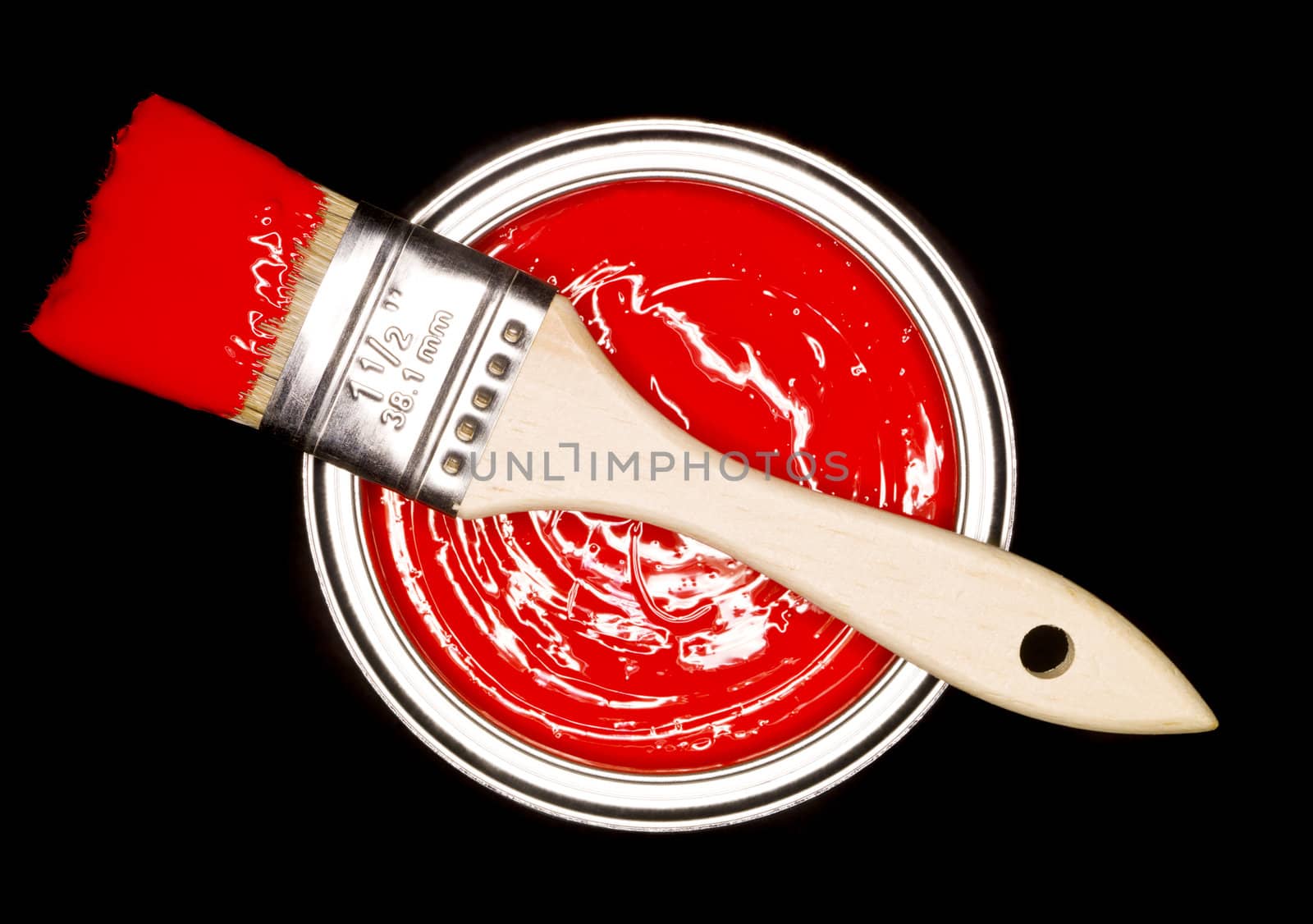 Red Paint can and brush from above on black background