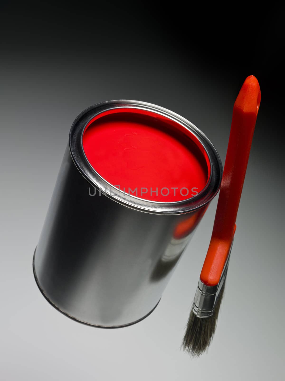 Red Paint can and brush on toned background