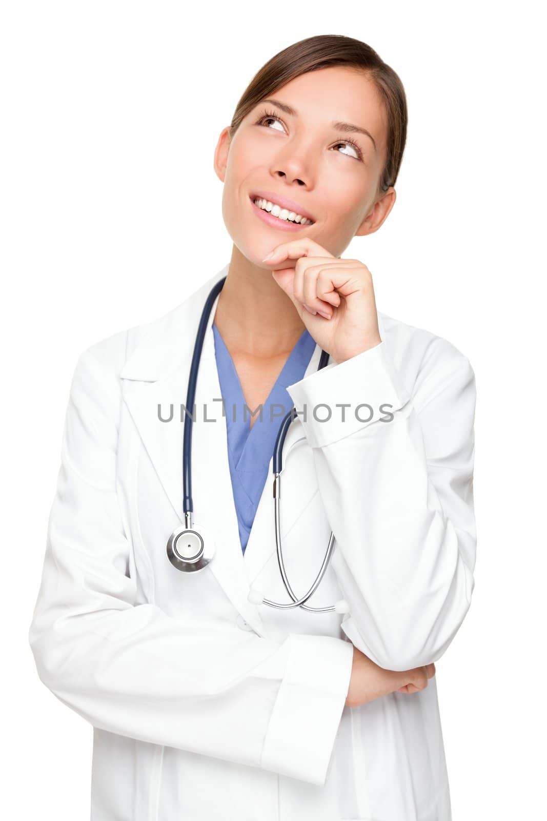 Thinking medical doctor looking up smiling. Multiracial Asian / Caucasian woman medical professional isolated on white background.