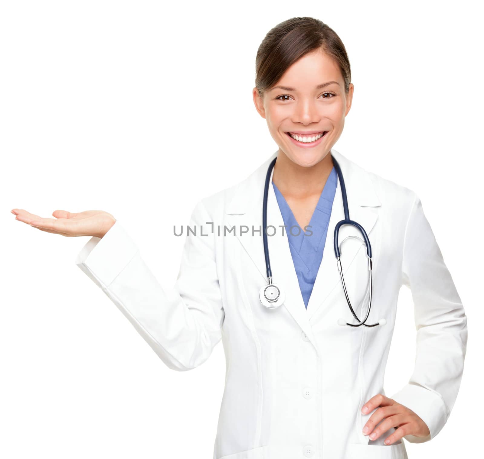Young medical doctor woman presenting and showing copy space for product or text. Multiracial Asian / Caucasian female medical professional isolated on white background.