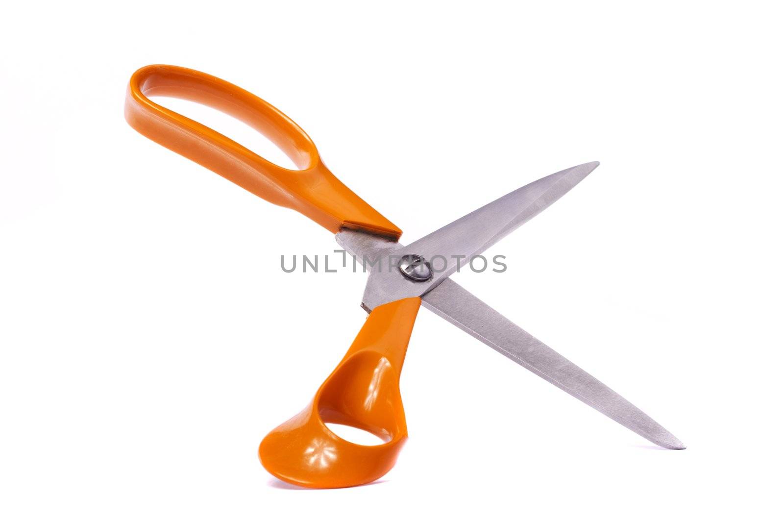 Close up view of an orange scissor isolated on a white background.