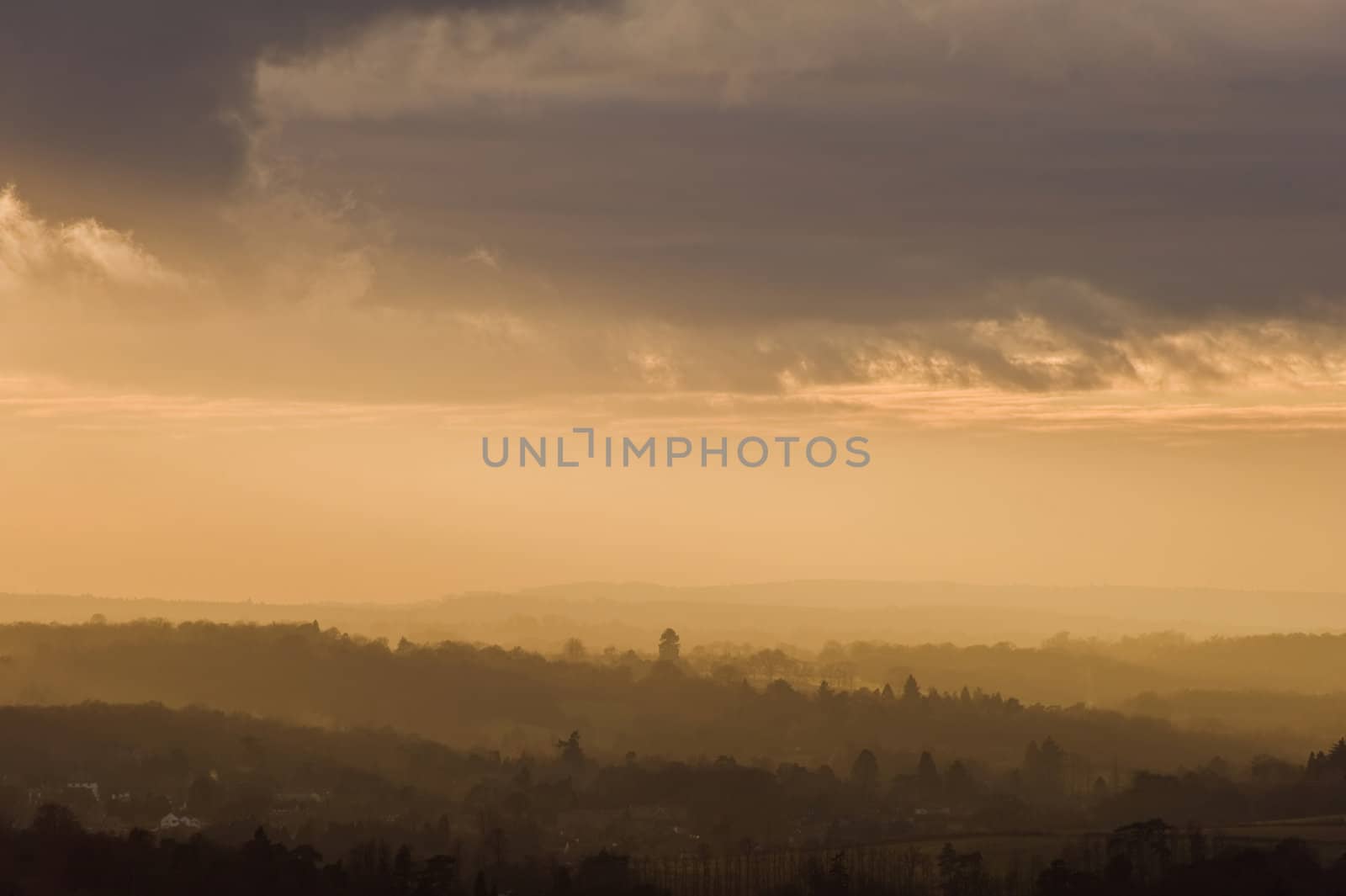 Stunning colorful sunset over countryside landscape by Veneratio