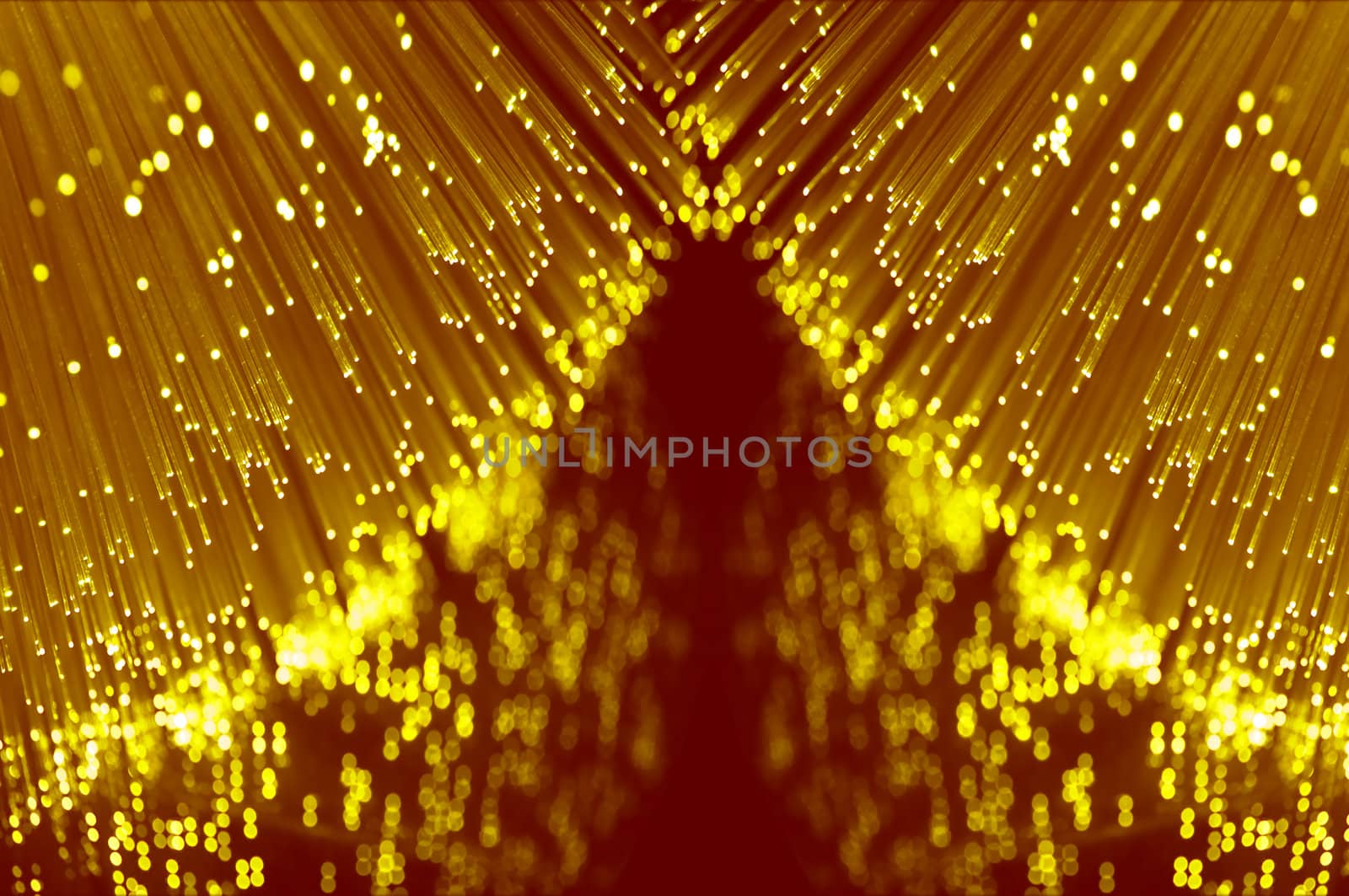 Close up abstract style capturing the ends of many illuminated fibre optic light strands reflecting into the foreground.