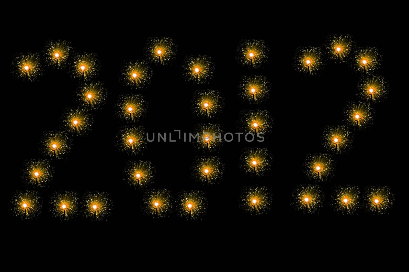 Many small illuminated yellow fibre optic lamps arranged on black background to spell the number 2012