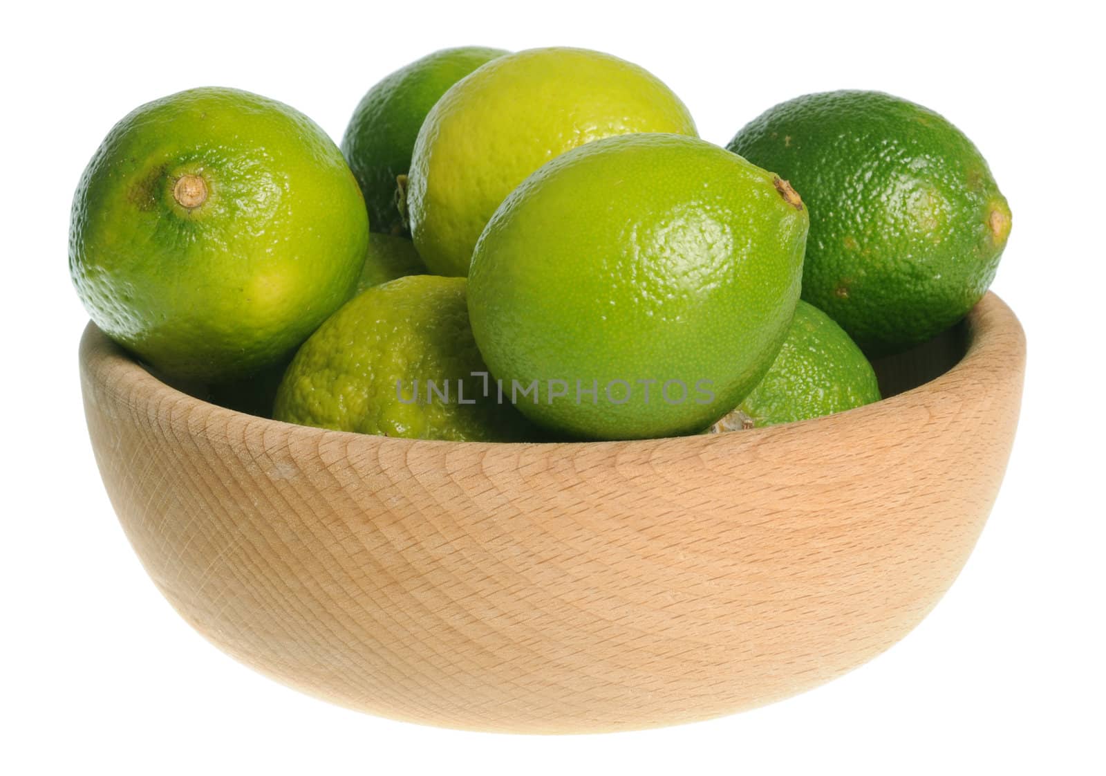 Wooden bowl filled with limes isolated on white background