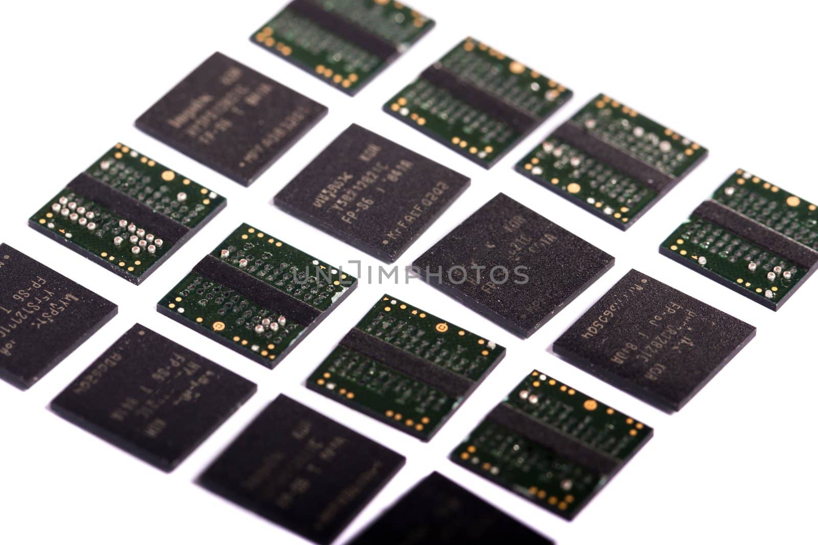 Close view of a bunch of computer memory chips isolated on a white background.