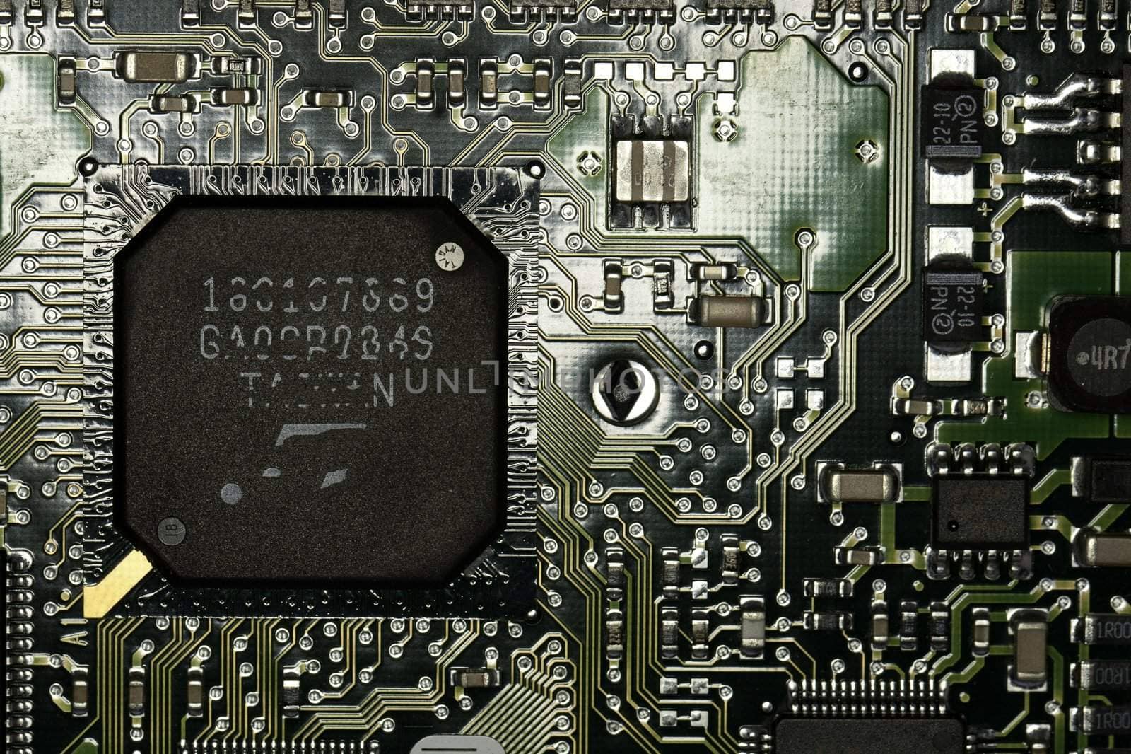 Close view detail of a circuit board with chips.
