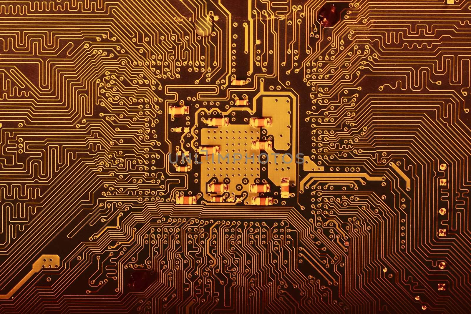 Close view of the circuits of a modern computer motherboard.