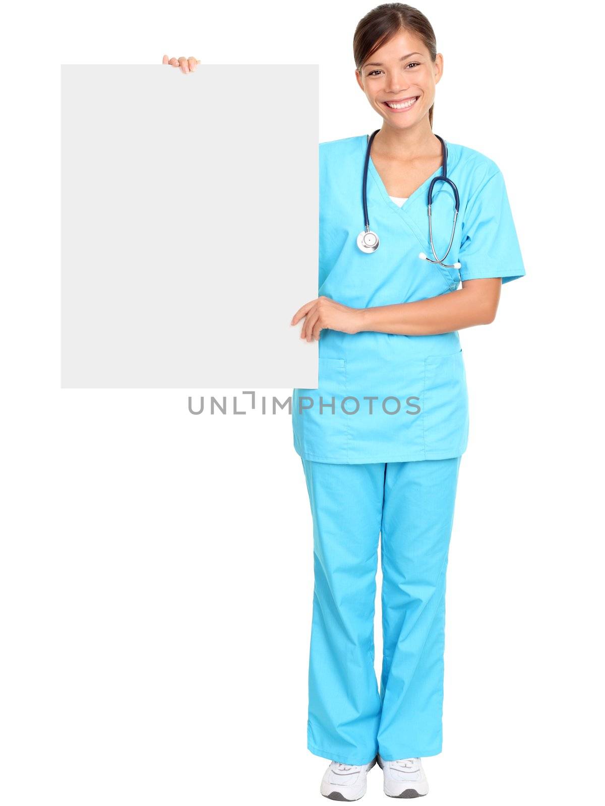 Medical doctor showing blank empty billboard sign poster. Young female doctor / nurse standing in full body isolated over white background. Asian / Caucasian woman.