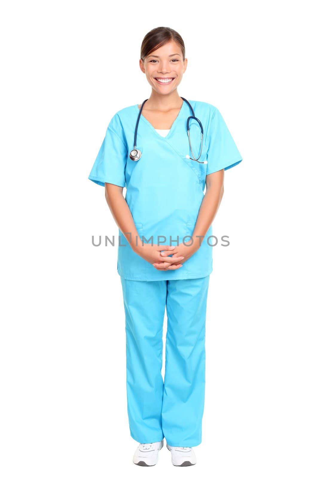 Nurse standing isolated over white background. Mixed-race Asian / Caucasian woman nurse or young medical doctor smiling in full length.