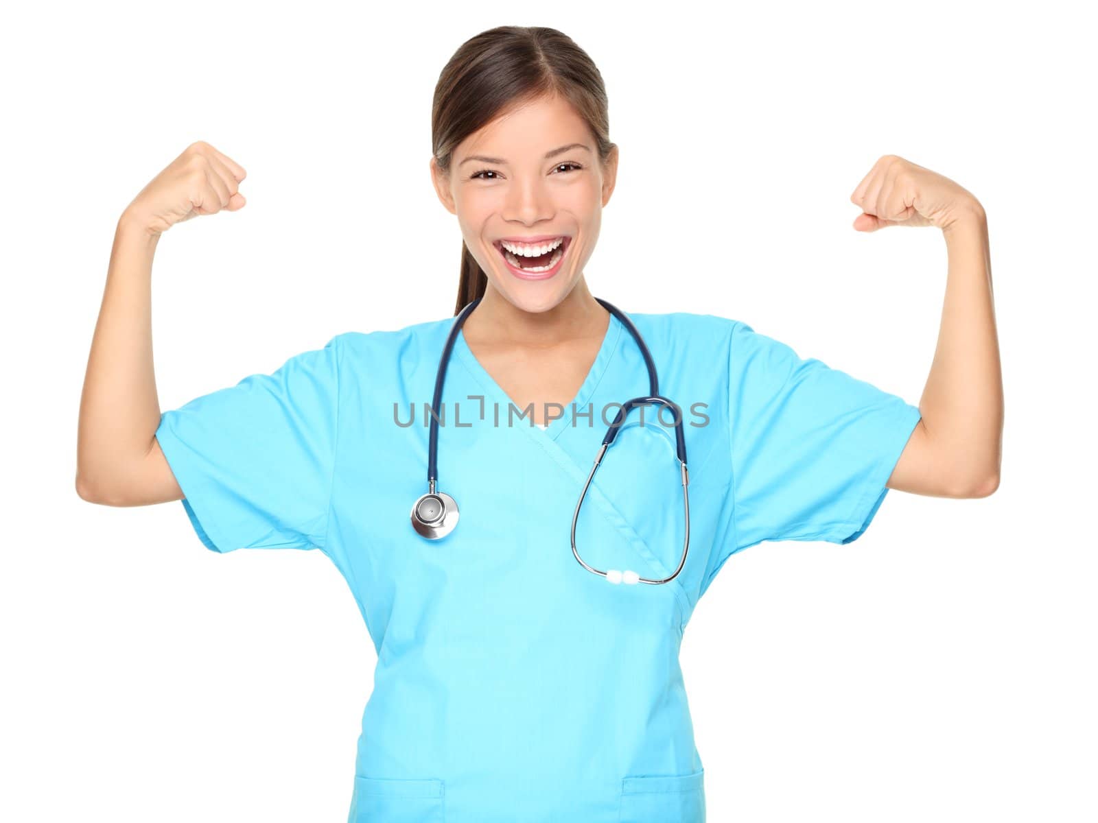 Nurse woman showing arm muscles smiling. Funny photo of successful young female nurse in blue scrub. Asian Caucasian woman isolated on white background.