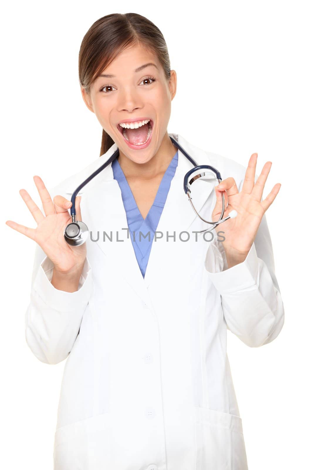 Medical student or young doctor showing her stethoscope happy and cheerful. Mixed Asian / Caucasian woman in her mid 20s.