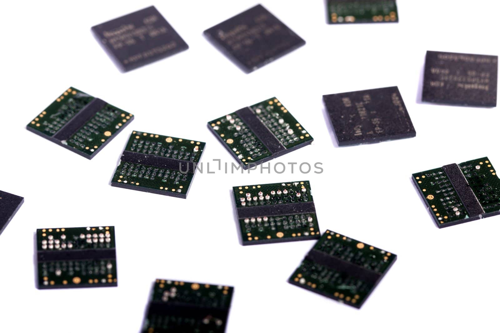Close view of a bunch of computer memory chips isolated on a white background.