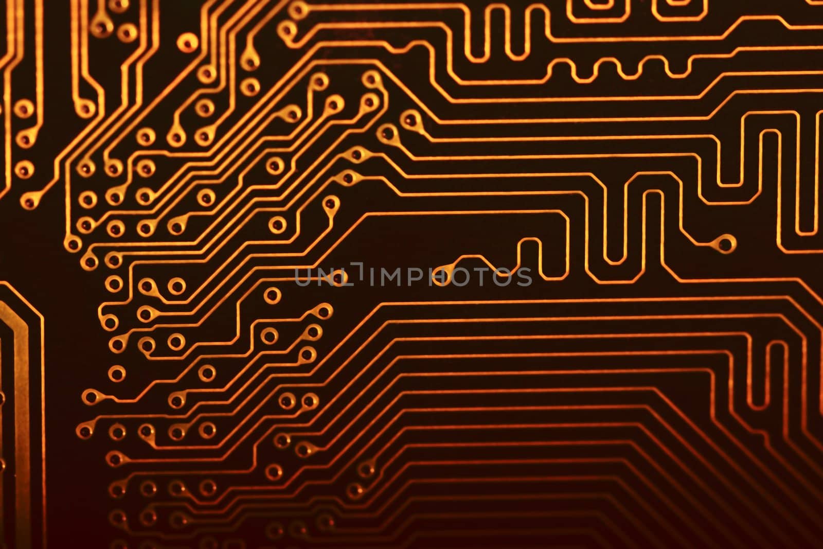 Close view of the circuits of a modern computer motherboard.