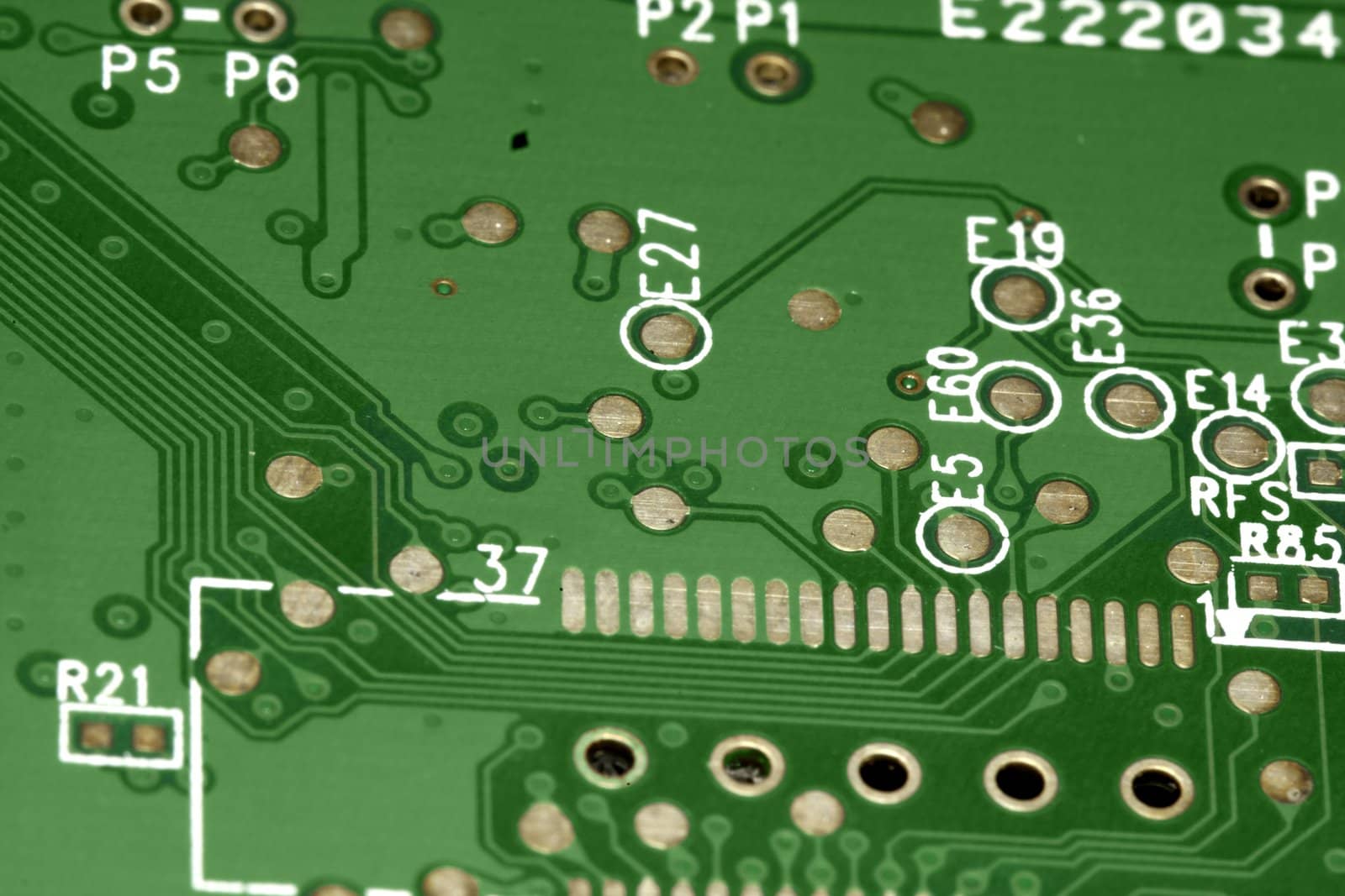 close view detail of a green computer circuit board.