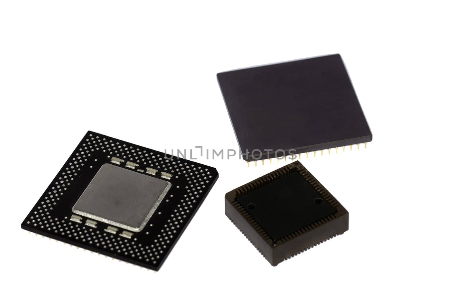 Close view detail of some computer microprocessors isolated on  a white background.