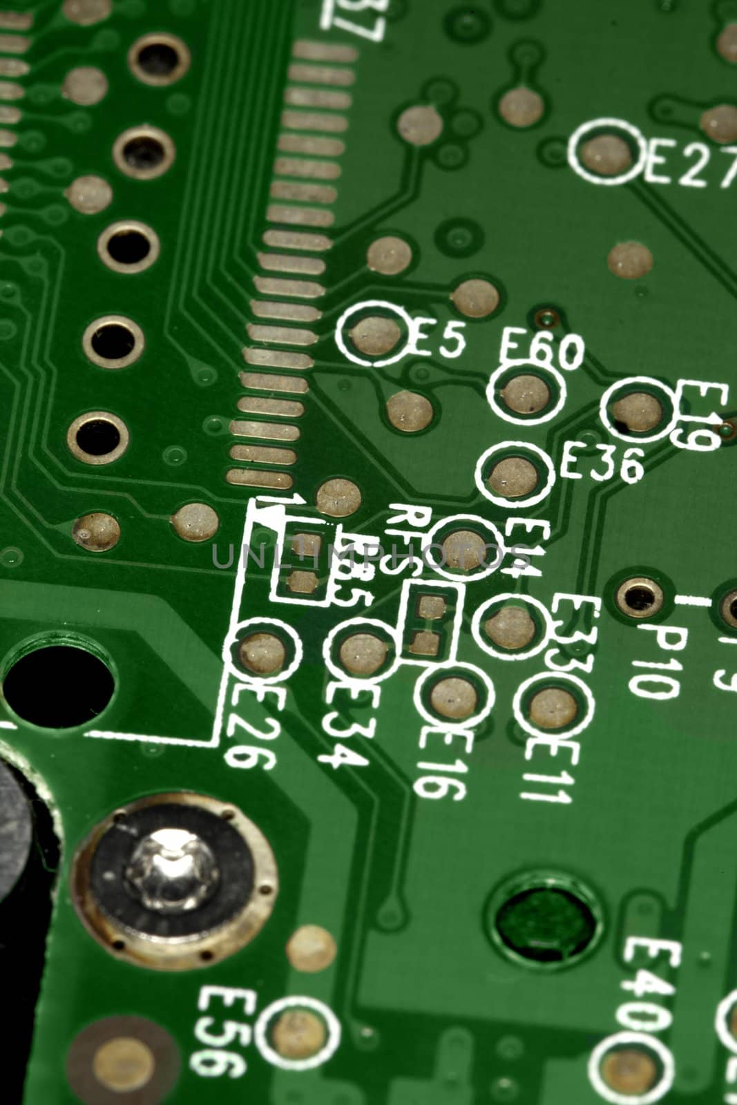 close view detail of a green computer circuit board.