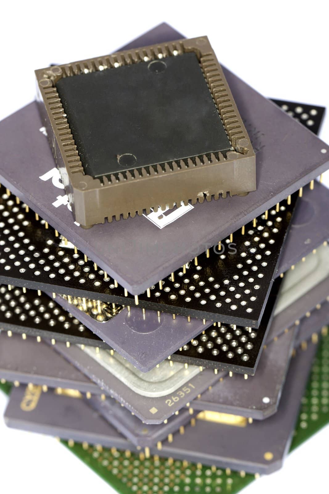 Close view detail of some computer microprocessors isolated on  a white background.