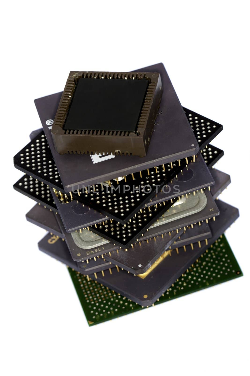 Close view detail of some computer microprocessors isolated on  a white background.
