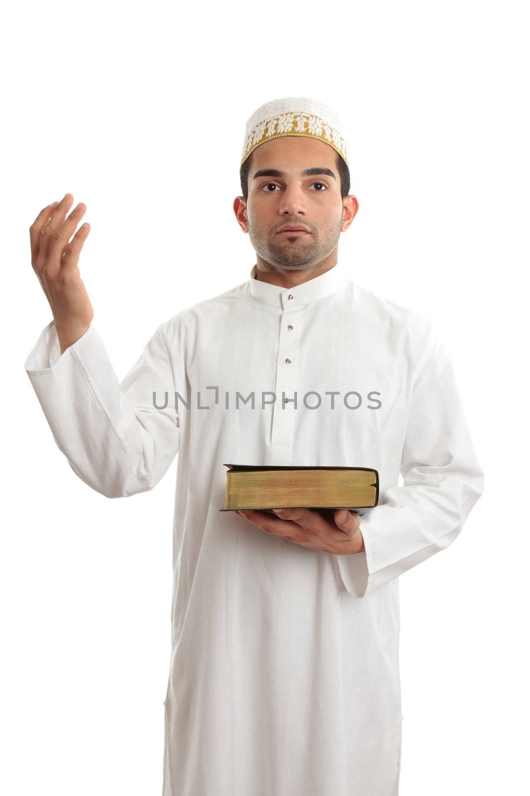 A man holding a holy book such as a bible or qur'an and hand raised in worship.  White background.