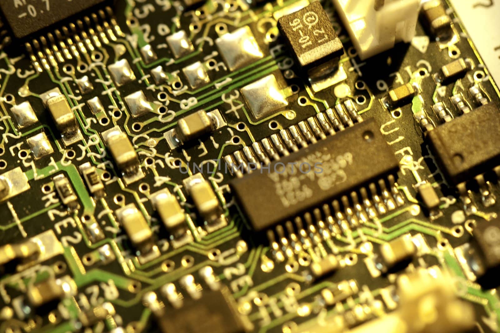 close view detail of   computer circuit chips on a golden light.