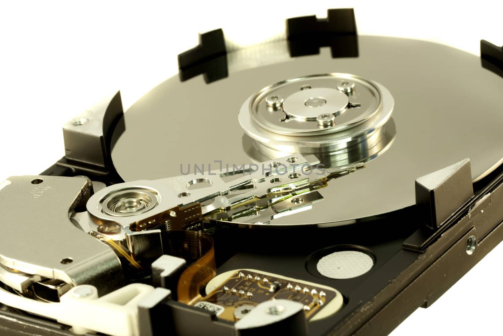 close view detail of the inside of a computer harddisk isolated on a white background.