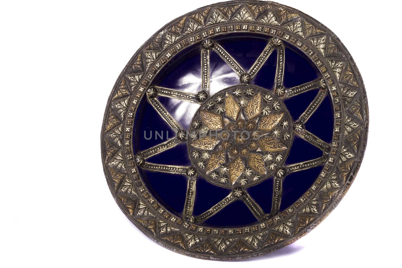 Close up view of a blue decorative morocco dish isolated on a white background.