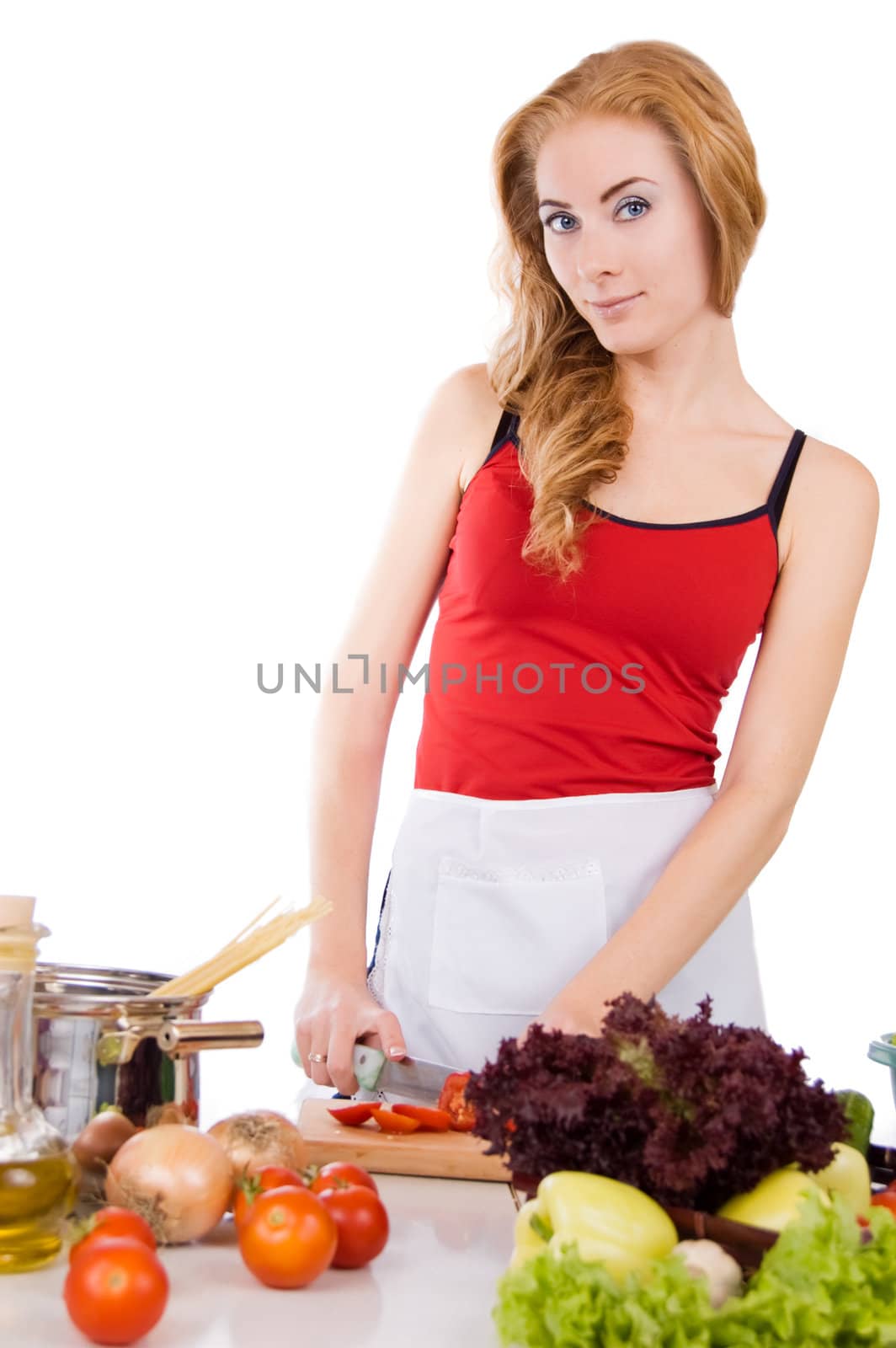 Woman inapron with pasta ingredients over white
