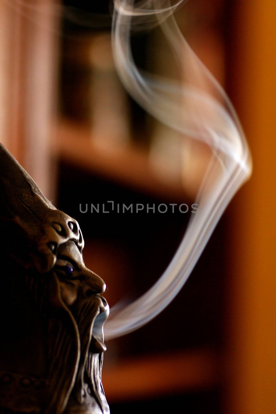 Close up view of a smoking doll with smoke.