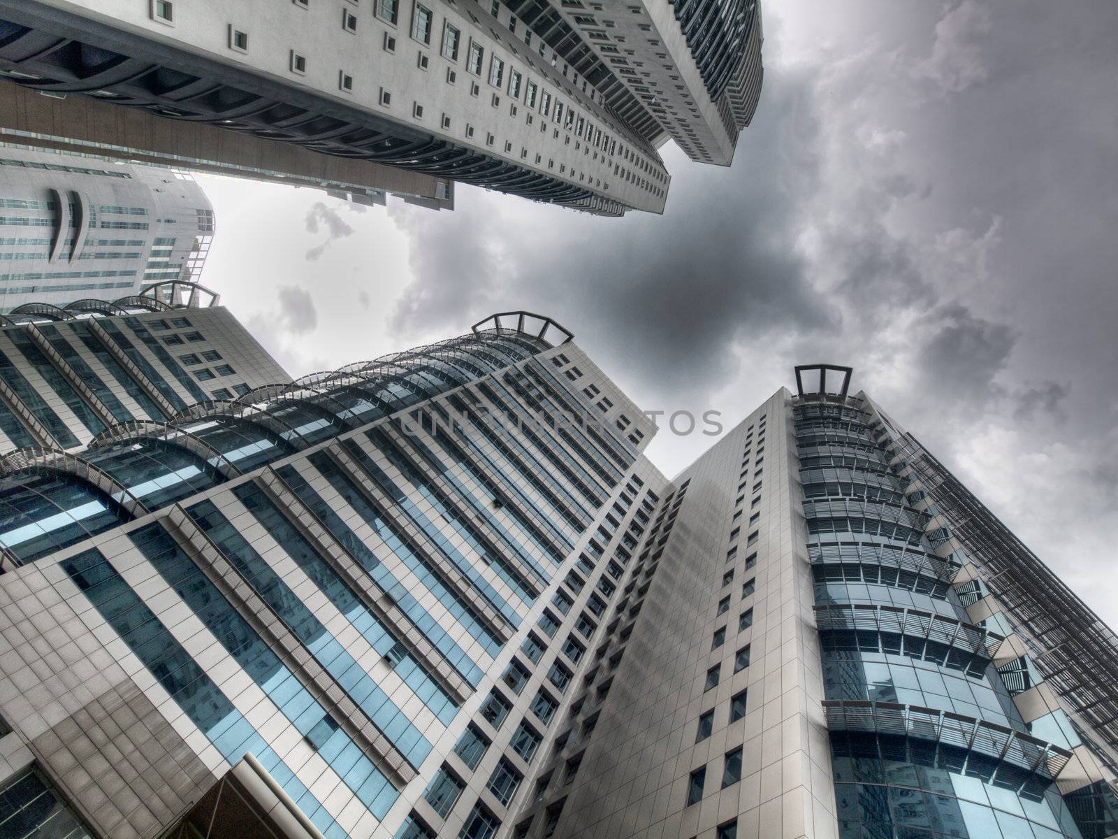 Corporate building soaring against a dramatic sky