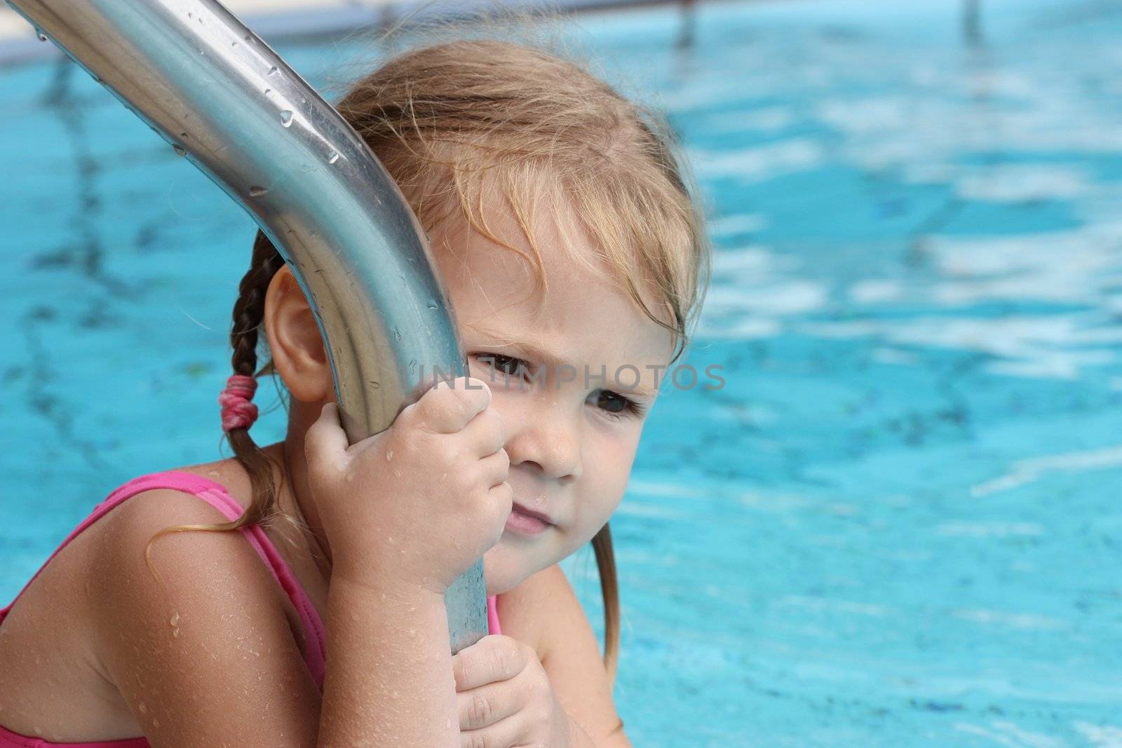 sad little girl in the pool