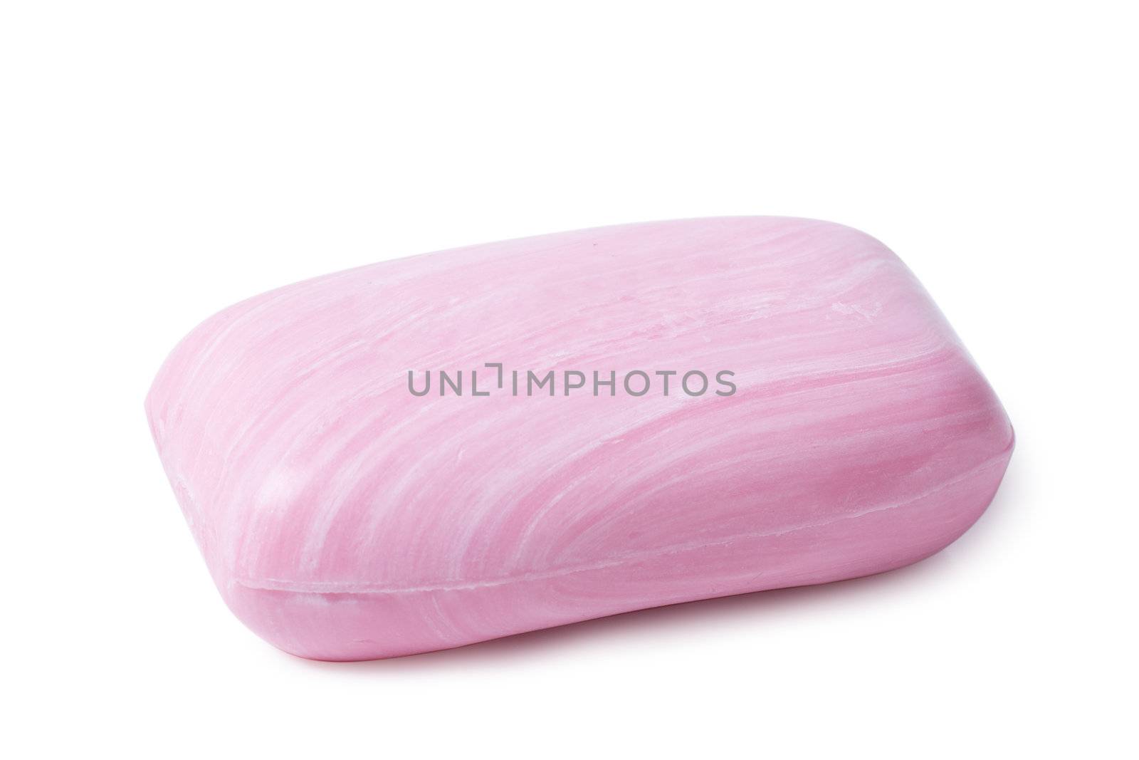Closeup view of pink soap with white stripes on the white