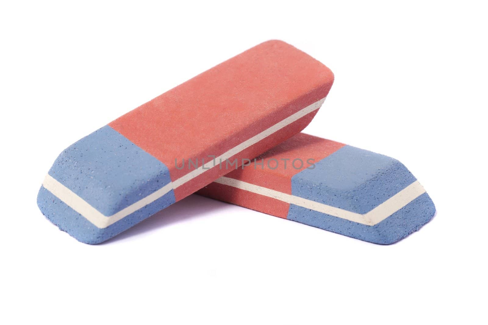 Close up view of a blue and red eraser isolated on a white background.