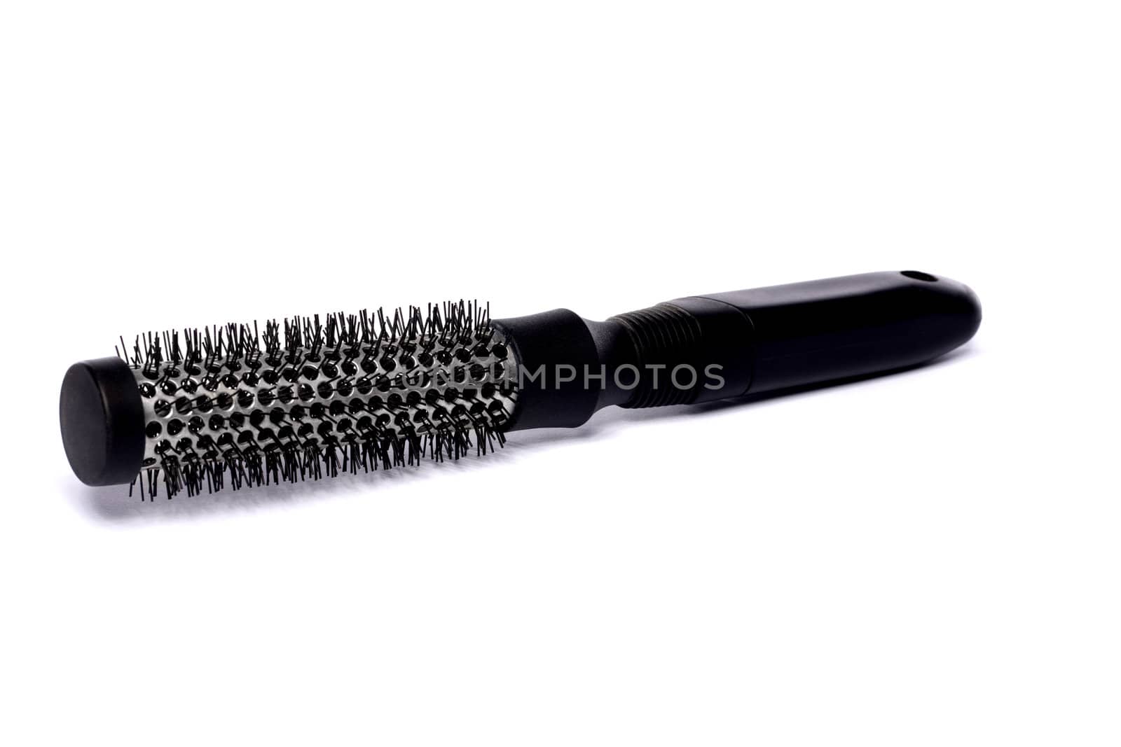 Close up view of a hair brush isolated on a white background.