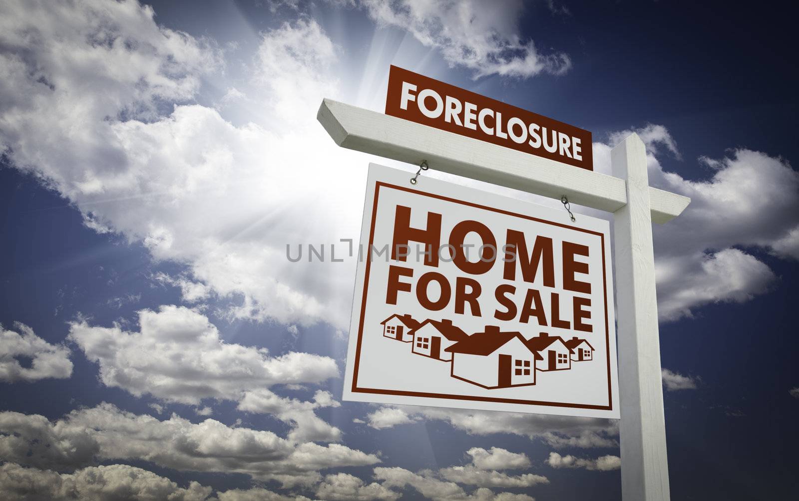 White Foreclosure Home For Sale Real Estate Sign Over Beautiful Clouds and Blue Sky.