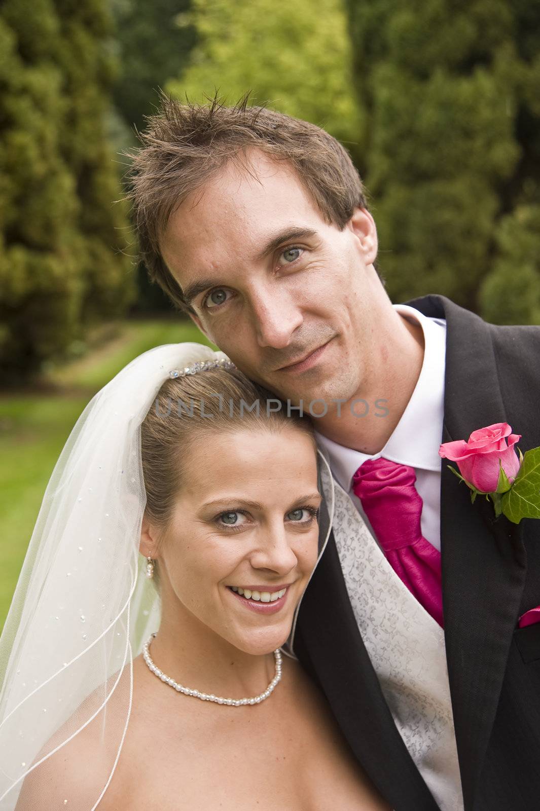 Attractive young bride and groom portrait outdoors
