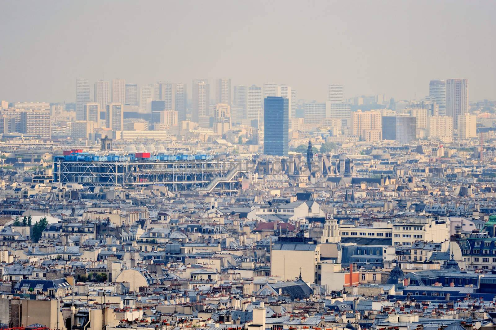Aerial panorama above houses rooftops in a Paris