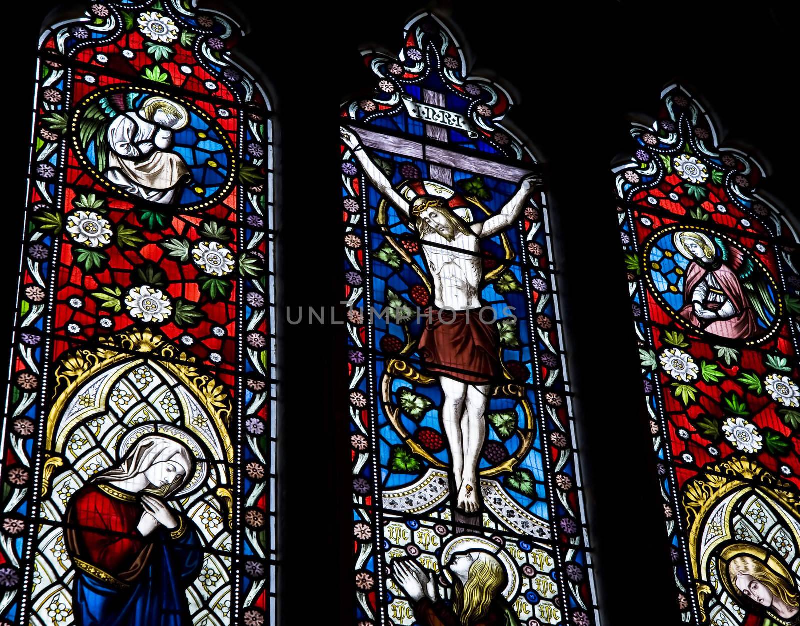 Detail of stained glass religious window in church Good Friday Easter